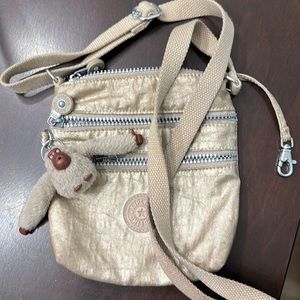 Gold/tan Kipling crossbody mini